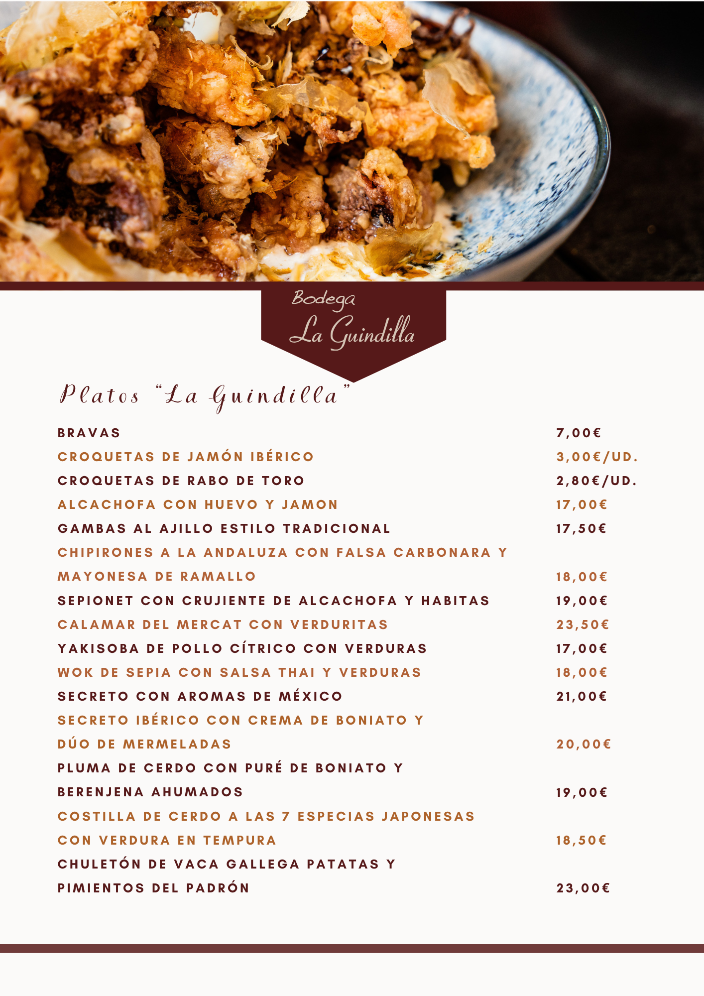 Menú de platos variados de Bodega La Guindilla, incluyendo bravas, croquetas y secreto ibérico con crema de boniato.