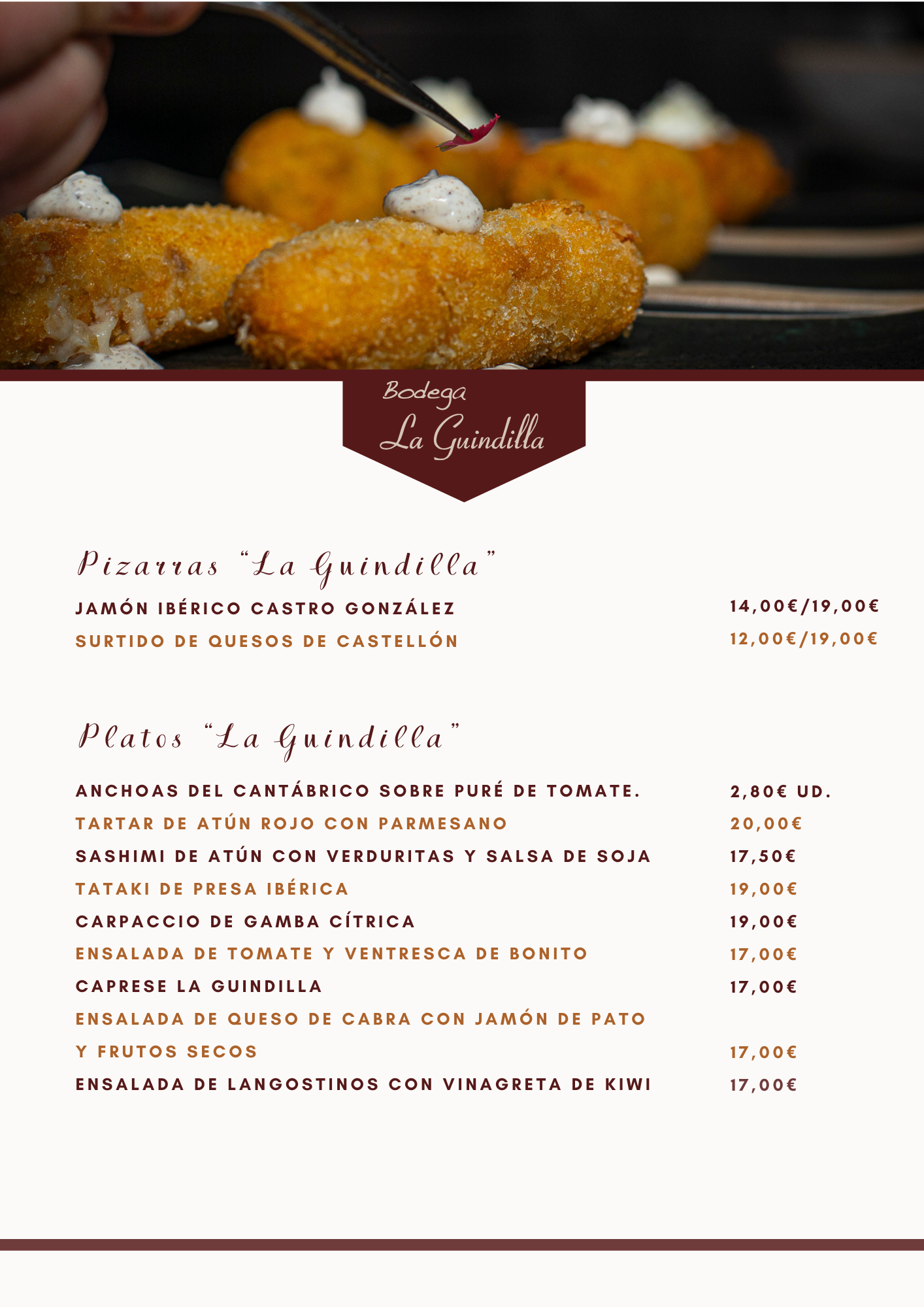 Mano decorando croquetas en un plato, menú de Bodega La Gundilla en la parte inferior.
